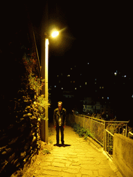 Tim at the Via di Corniglia street, with a view on Manarola, by night