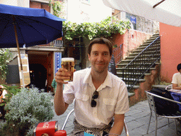 Tim with a beer at the terrace of the Caffe Matteo restaurant at the Largo Taragio square at Corniglia