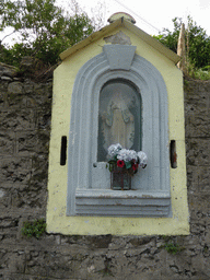 Statue and flowers at the top of the Scalinata Lardarina staircase at Corniglia