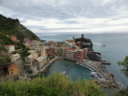 The town of Vernazza with its harbour, the Chiesa di Santa Margherita d`Antiochia church and the Doria Castle, viewed from the path to Monterosso al Mare