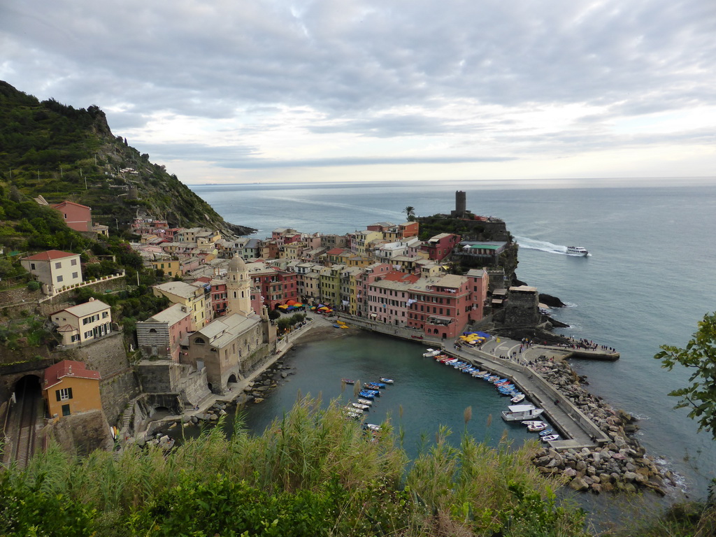 The town of Vernazza with its harbour, the Chiesa di Santa Margherita d`Antiochia church and the Doria Castle, viewed from the path to Monterosso al Mare