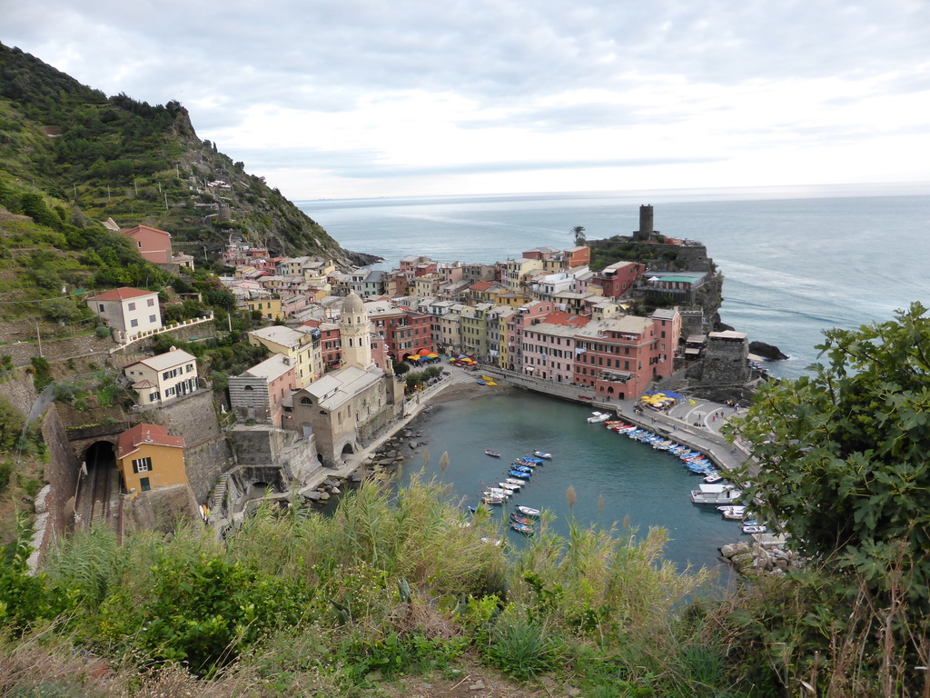 The town of Vernazza with its harbour, the Chiesa di Santa Margherita d`Antiochia church and the Doria Castle, viewed from the path to Monterosso al Mare