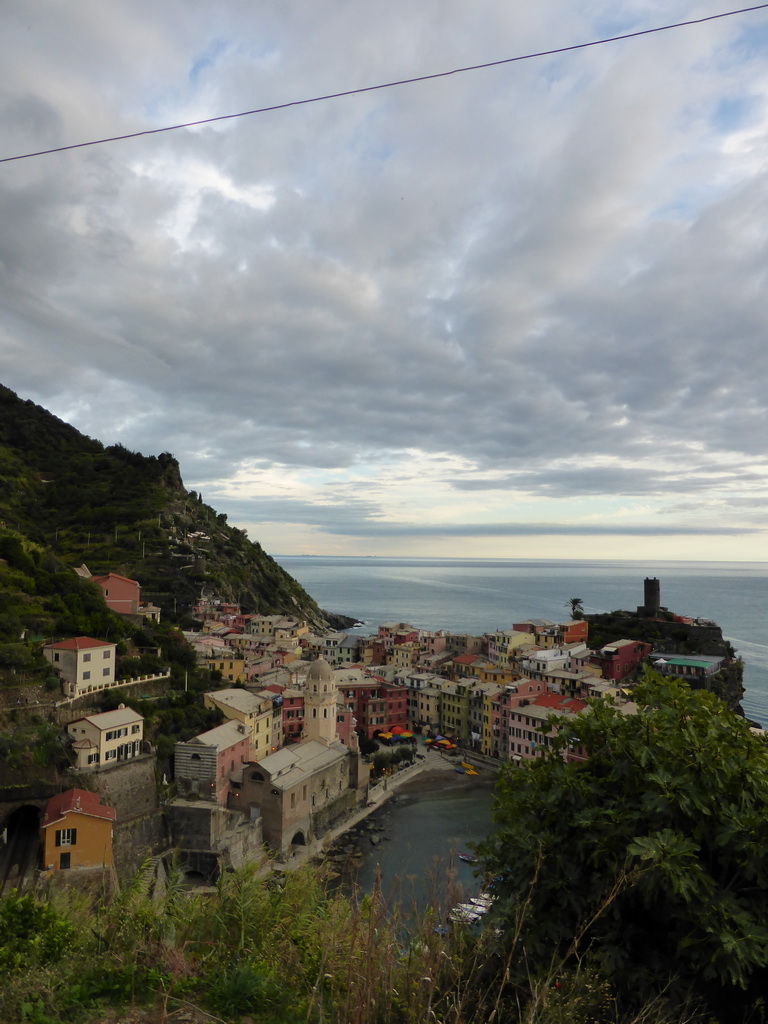 The town of Vernazza with its harbour, the Chiesa di Santa Margherita d`Antiochia church and the Doria Castle, viewed from the path to Monterosso al Mare