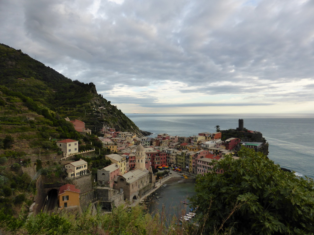 The town of Vernazza with its harbour, the Chiesa di Santa Margherita d`Antiochia church and the Doria Castle, viewed from the path to Monterosso al Mare