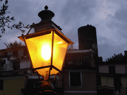 Street lantern and the Doria Castle at Vernazza, at sunset