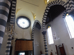 Stained glass windows and the nave of the Chiesa di San Giovanni Battista church at Monterosso al Mare