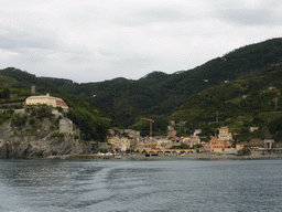 Monterosso al Mare with its harbour and beach and the Torre Aurora tower, viewed from the ferry to Vernazza
