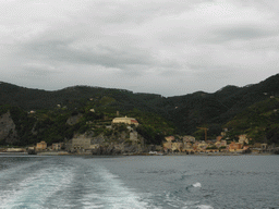 Monterosso al Mare with its harbour and beach and the Torre Aurora tower, viewed from the ferry to Vernazza