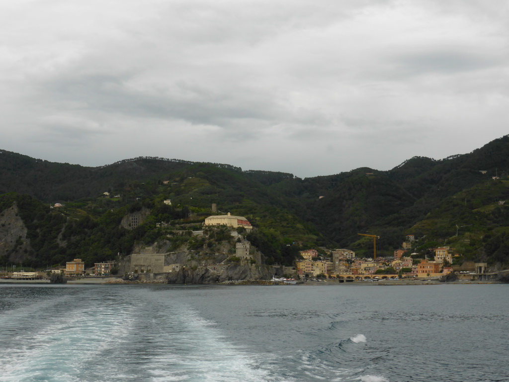 Monterosso al Mare with its harbour and beach and the Torre Aurora tower, viewed from the ferry to Vernazza