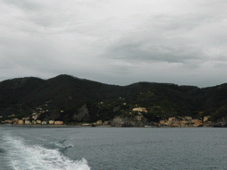 The new town and the old town of Monterosso al Mare with its harbour and beach and the Torre Aurora tower, viewed from the ferry to Vernazza