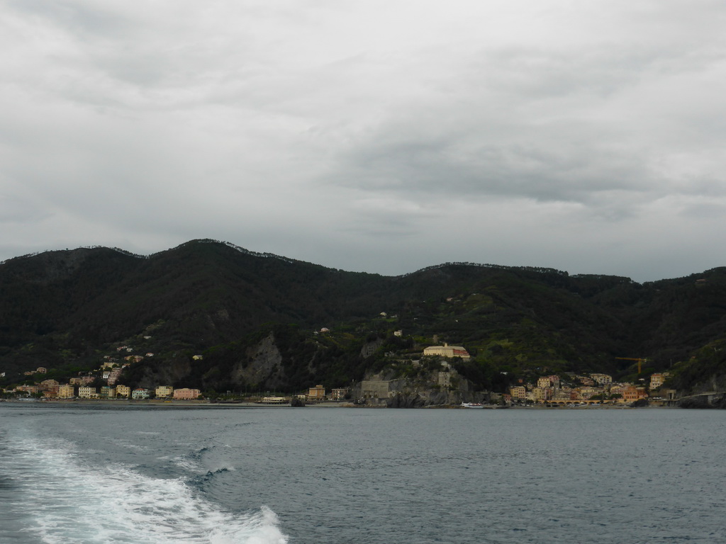 The new town and the old town of Monterosso al Mare with its harbour and beach and the Torre Aurora tower, viewed from the ferry to Vernazza