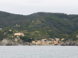 Monterosso al Mare with its harbour and beach and the Torre Aurora tower, viewed from the ferry to Vernazza