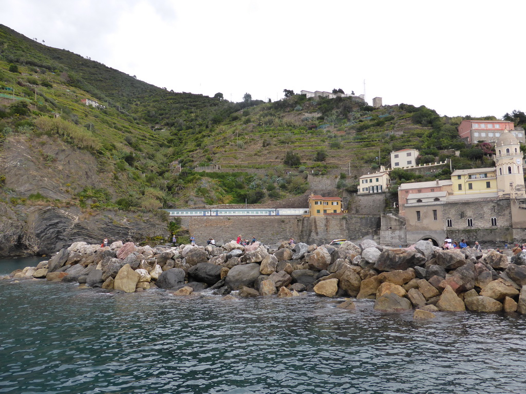 The harbour and railway of Vernazza and the Chiesa di Santa Margherita d`Antiochia church, viewed from the ferry from Monterosso al Mare