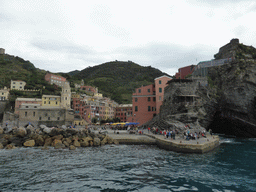 The harbour of Vernazza, the Piazza Marconi square, the Chiesa di Santa Margherita d`Antiochia church and the Doria Castle, viewed from the ferry to Manarola