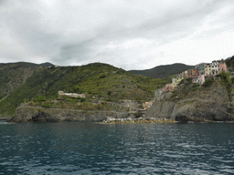 The Punta Bonfiglio hill and the harbour of Manarola, viewed from the ferry from Vernazza