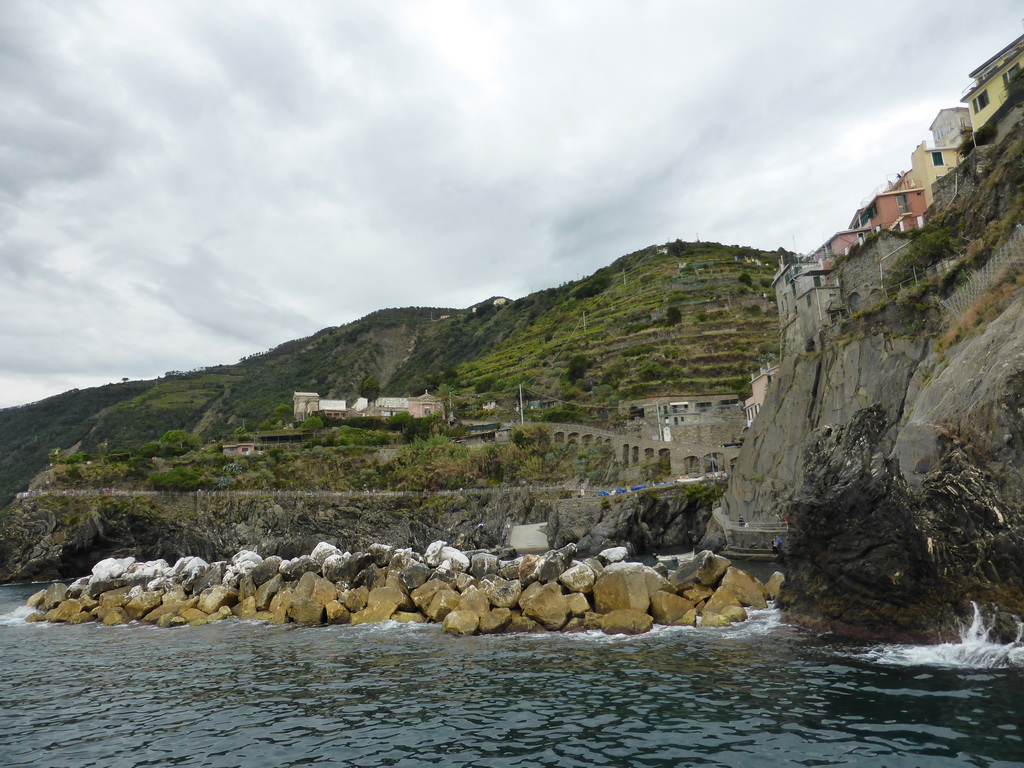 The Punta Bonfiglio hill and the harbour of Manarola, viewed from the ferry from Vernazza