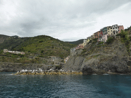The Punta Bonfiglio hill and the harbour of Manarola, viewed from the ferry to Riomaggiore