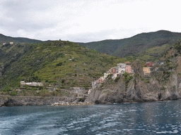 Manarola, its harbour and the Punta Bonfiglio hill, viewed from the ferry to Riomaggiore