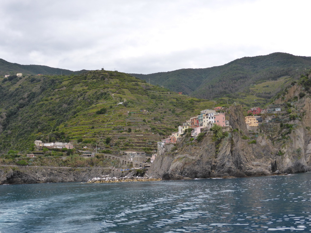 Manarola, its harbour and the Punta Bonfiglio hill, viewed from the ferry to Riomaggiore