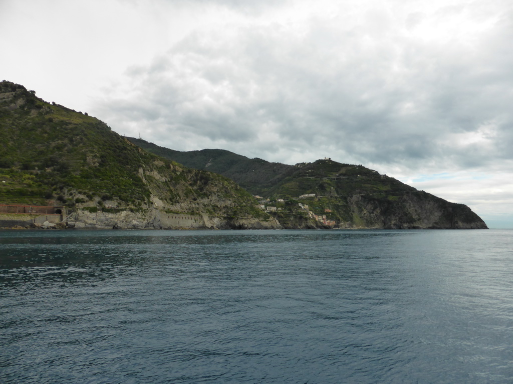 The Via dell`Amore path and Riomaggiore, viewed from the ferry from Manarola