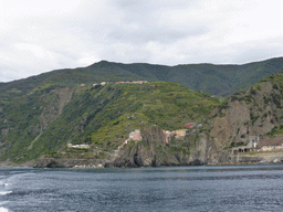 Manarola, its railway station and the Punta Bonfiglio hill, viewed from the ferry to Riomaggiore