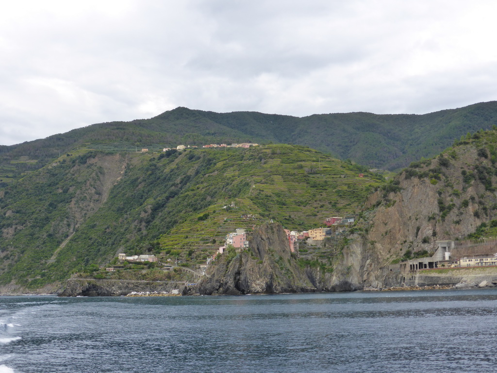 Manarola, its railway station and the Punta Bonfiglio hill, viewed from the ferry to Riomaggiore