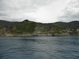 The railway station of Manarola, the Via dell`Amore path and Riomaggiore, viewed from the ferry