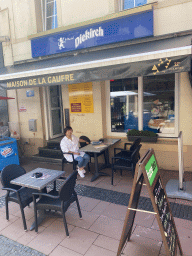Miaomiao at the terrace of the La Maison De La Gaufre restaurant at the Grand Rue street