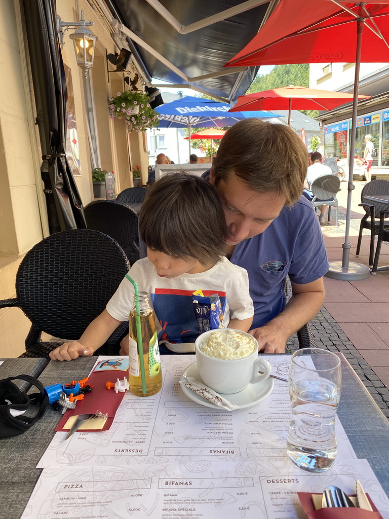 Tim and Max having drinks at the terrace of the La Maison De La Gaufre restaurant