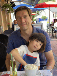 Tim and Max having drinks at the terrace of the La Maison De La Gaufre restaurant