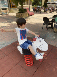 Max on a seesaw at the Place du Marché square