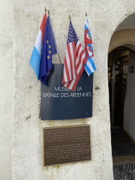 Flags and signs at the entrance to the Museum of the Battle of the Ardennes Clervaux at Clervaux Castle