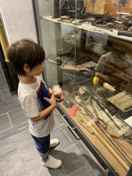 Max looking at weapons at the Museum of the Battle of the Ardennes Clervaux at Clervaux Castle