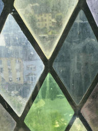 Stained glass at the Family of Man exhibition at Clervaux Castle, with a view on the town center