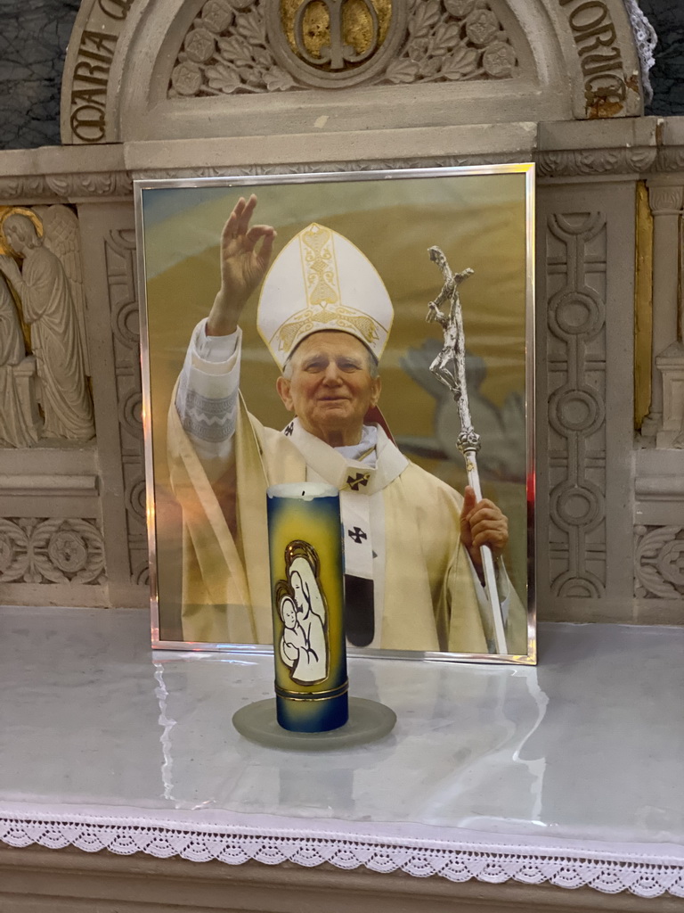 Candle and photograph of Pope John Paul II at the Church of Clervaux