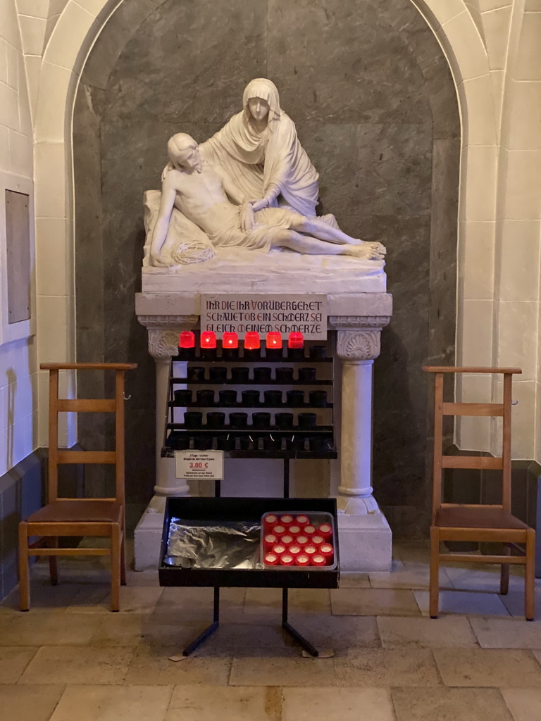 Candles and statue at the Church of Clervaux