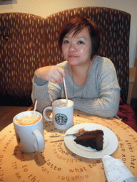 Miaomiao having coffee and cake in the Starbucks shop at the Ehrenstraße street