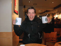 Tim with coffee in the Starbucks shop at the Ehrenstraße street