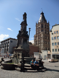 Fountain at the Alter Markt square and the tower of the Cologne City Hall (Kölner Rathaus)
