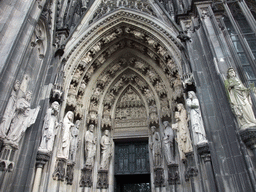 Statues and reliefs above the entrance gate at the west side of the Cologne Cathedral