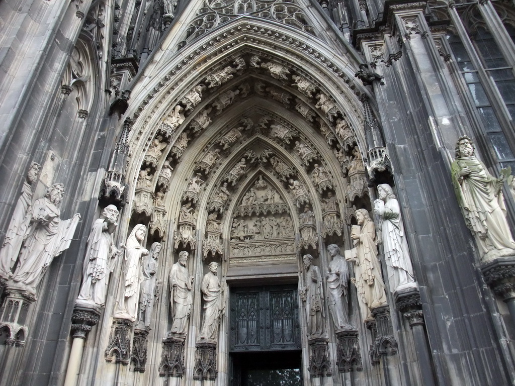 Statues and reliefs above the entrance gate at the west side of the Cologne Cathedral