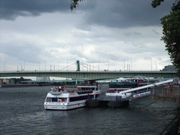 Boats and the Deutzer Brücke over the Rhein river, viewed from the Fischmarkt square