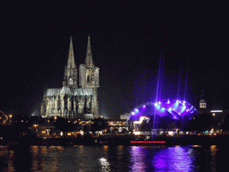 The Rhein river, the Cologne Cathedral, the Musical Dome Köln and the tower of the Basilica church of St. Ursula, viewed from the Kennedy-Ufer street, by night
