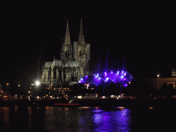 The Rhein river, the Cologne Cathedral, the Musical Dome Köln and the tower of the Basilica church of St. Ursula, viewed from the Kennedy-Ufer street, by night