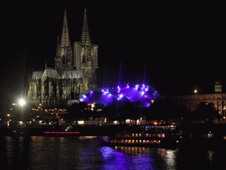 The Rhein river, the Cologne Cathedral, the Musical Dome Köln and the tower of the Basilica church of St. Ursula, viewed from the Kennedy-Ufer street, by night