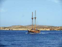 Boat near the Blue Lagoon, viewed from the Luzzu Cruises tour boat from Gozo to Comino