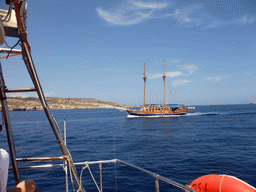 Boat and the east coast of Gozo, viewed from the Luzzu Cruises tour boat from Gozo to Comino