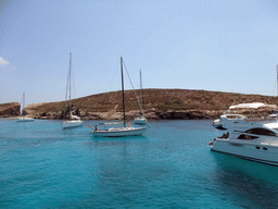 Boats at the Blue Lagoon, viewed from the Luzzu Cruises tour boat from Gozo to Comino