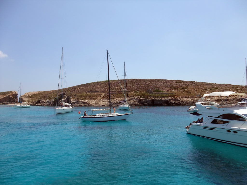 Boats at the Blue Lagoon, viewed from the Luzzu Cruises tour boat from Gozo to Comino