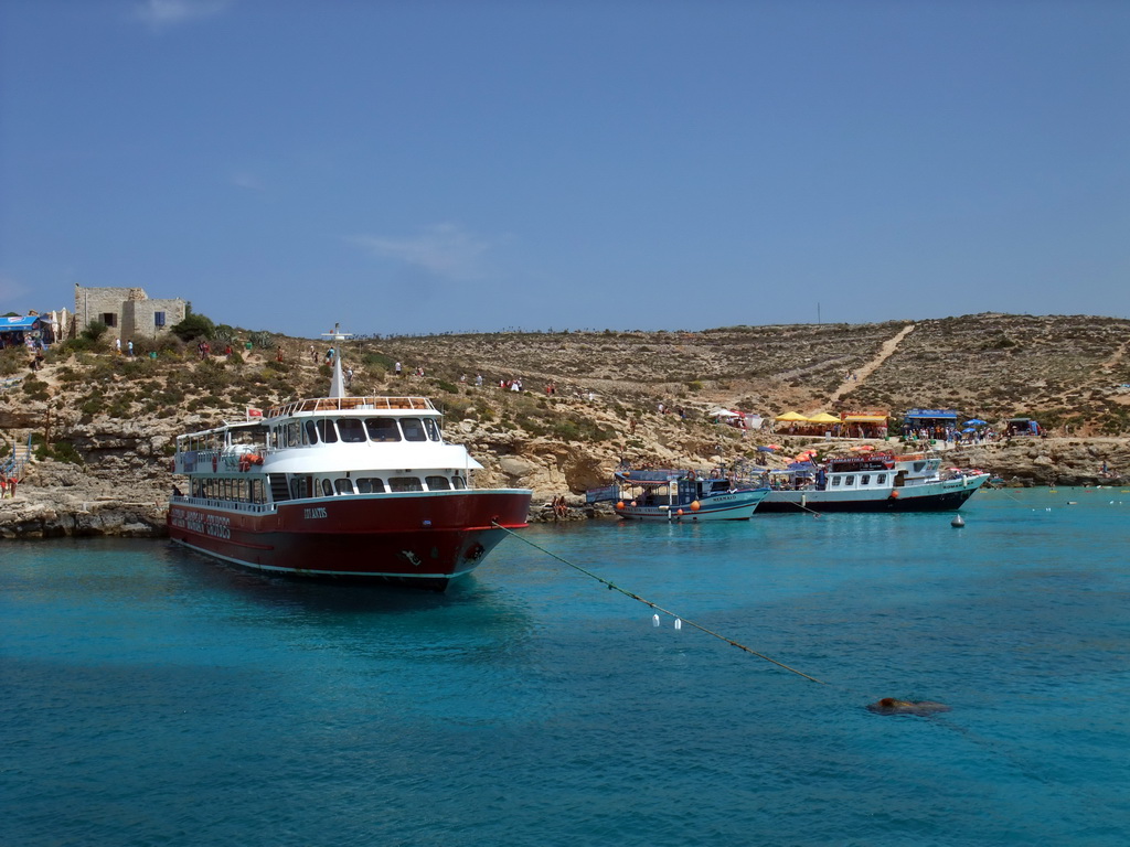 Boats at the Blue Lagoon, viewed from the Luzzu Cruises tour boat from Gozo to Comino